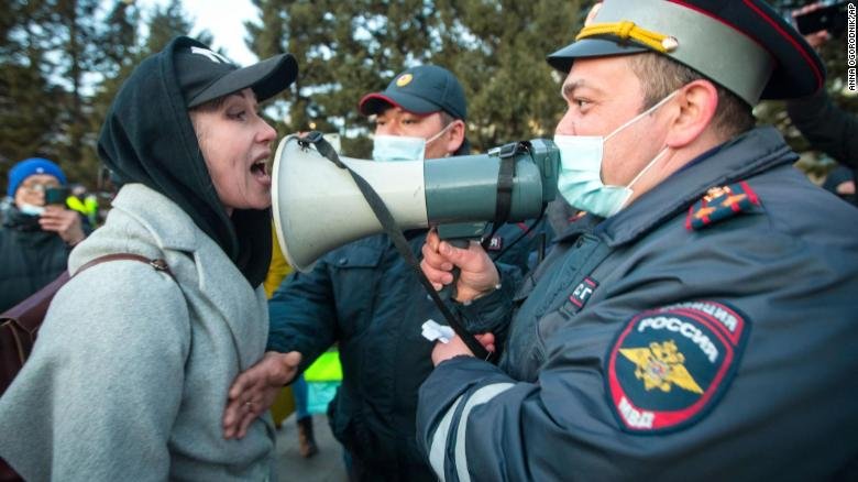 A woman argues with a police officer during a protest in support of jailed opposition leader Alexey Navalny